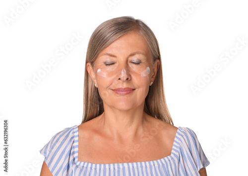 Beautiful senior woman with sun protection cream on her face isolated on white © New Africa