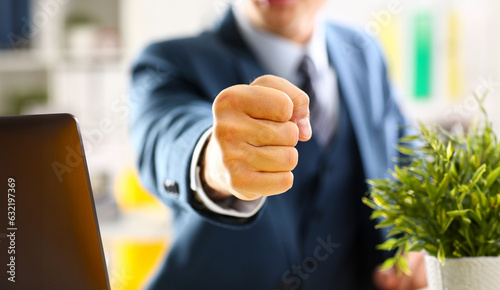 Male clenched fist in suit at office closeup. Aggressive career strategy angry negotiation strong riot solution for freedom victory participation concept