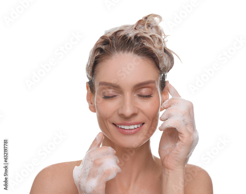 Beautiful happy woman washing hair on white background