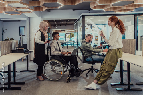 Young group of business people brainstorming together in a startup space, discussing business projects, investments, and solving challenges.