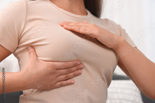 Wallpaper Mural Woman doing breast self-examination at home, closeup Torontodigital.ca