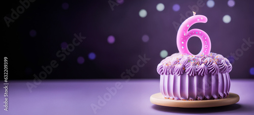 Decorated Birthday cake with a single six candle for for kids sixth birthday with copy space