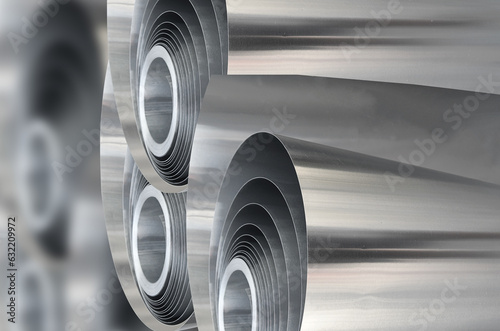 three rolls of aluminum metal material with blur background. selective focus
