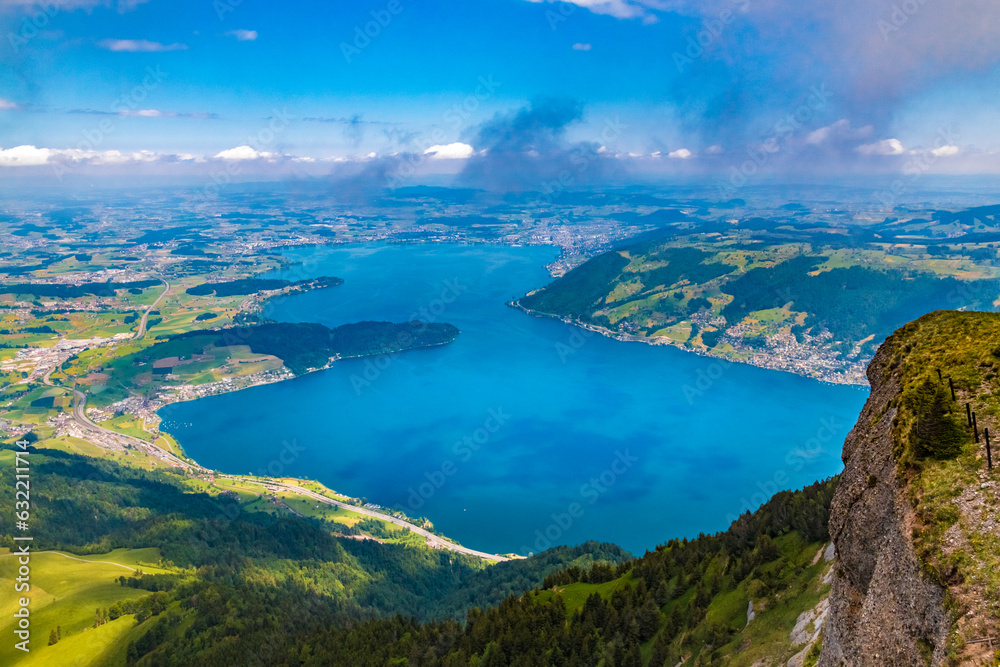 Beautiful bird's-eye view of Lake Zug in Central Switzerland, viewed from the summit of Mount Rigi Kulm. It stretches for 14 km between Arth and the Cham-Zug bay. Beautiful bird's-eye view of Lake Zug in Central Switzerland, viewed from the summit of Mount Rigi Kulm. It stretches for 14 km between Arth and the Cham-Zug bay.