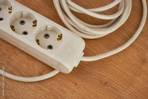 triple electrical extension cable on the floor