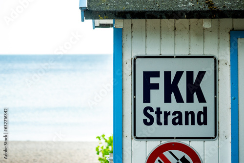Nudist sign on a beach at the Baltic Sea photo