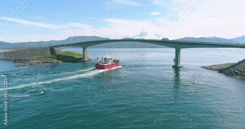 Aerial Drone View of Boat and Atlantic Ocean Road Bridge in Norway