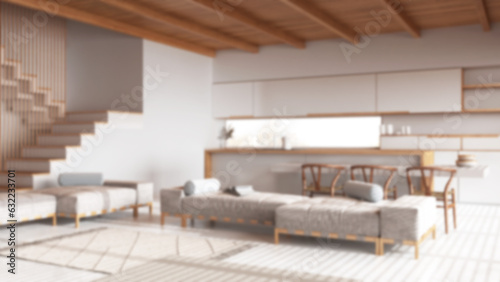 Blurred background, wooden japandi living room and kitchen with resin floor and beams ceilings. Sofas and carpets, island with chairs. Minimal interior design