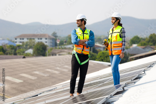 Wallpaper Mural electrical engineering team man and woman worker Installing Solar Cell panels on Roof. Solar energy clean and green alternative energy. Unity and teamwork Torontodigital.ca