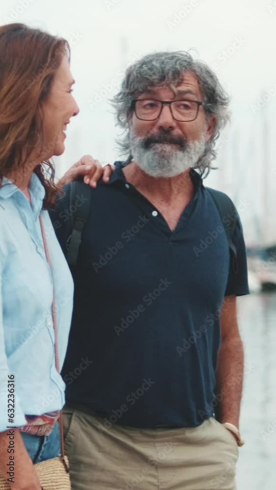 Lovely elderly couple are walking in the port Lovely elderly couple are walking in the port
