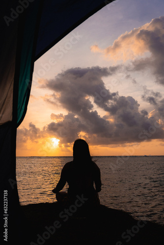 silhouette of a woman on the beach