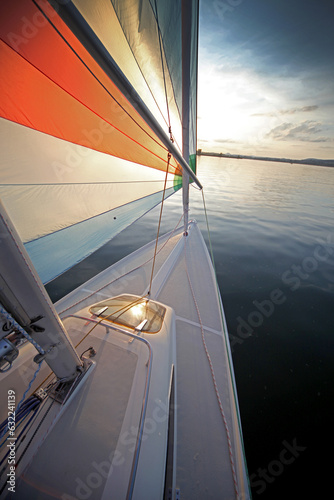 On-Board View of a Sailboat at Sunset