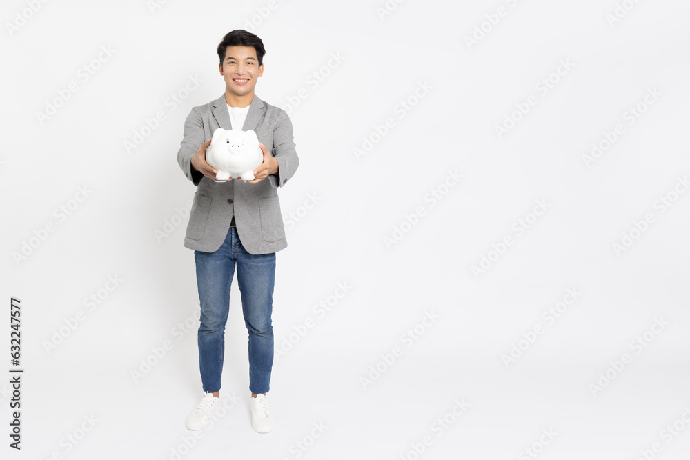Portrait of Happy Asian businessman smile and holding white piggy bank isolated on white background, Business and financial concept Portrait of Happy Asian businessman smile and holding white piggy bank isolated on white background, Business and financial concept
