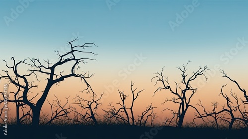 Outline of bare trees against a cloudless sky