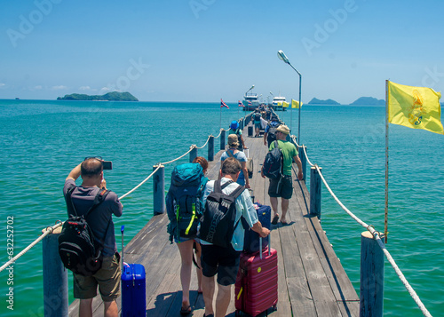 Tourists embark on speed boats
