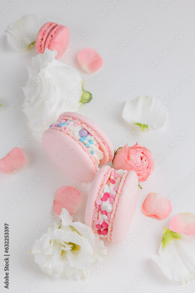 Top view Set Beautiful colorful French macaroons and flowers. Spring Flat lay white background