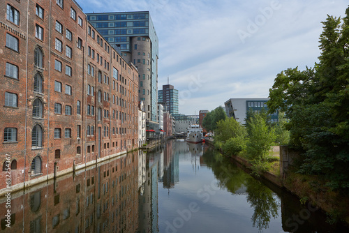 a ship in hamburg between the houses