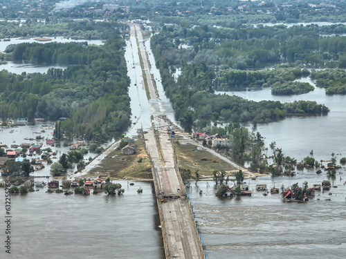 The Antonovskiy bridge in Kherson. after the explosion. View of the city of Oleshki. Destroyed bridge. Top aerial view.  photo