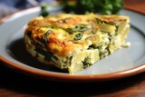 partially cooked frittata flipped onto a plate