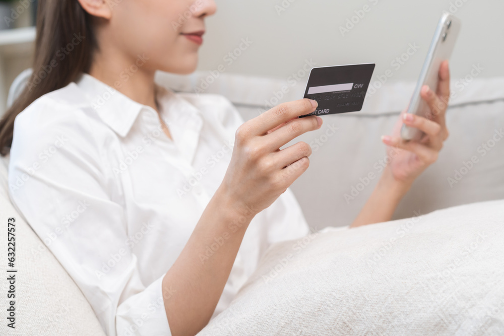 Online internet banking, asian young woman hand in payment spending by scan qr code, use phone, mobile to transfer money or pay money of credit card without cash at home. Technology of financial. Online internet banking, asian young woman hand in payment spending by scan qr code, use phone, mobile to transfer money or pay money of credit card without cash at home. Technology of financial.