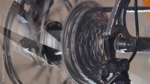 Turning the chain and stars to check the bike. Close-up view. The bicycle workshop. The chain moves over the cassette as the drivetrain is adjusted