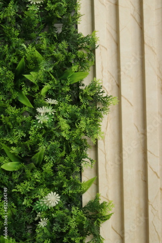 Artificial Herbaceous plant with white Flower aside with marble Texture WPC sheet