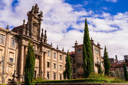 View of the Monastery of San Martin Pinario, with a majestic interior, a museum of religious art and a facade with a carved stone altarpiece. Photograph taken in Santiago de Compostela, Galicia, Spain photo