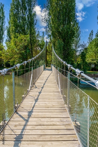 Fototapeta Naklejka Na Ścianę i Meble -  San Andres footbridge over the Pisuerga river in Herrera de Pisuerga, Palencia, Spain.