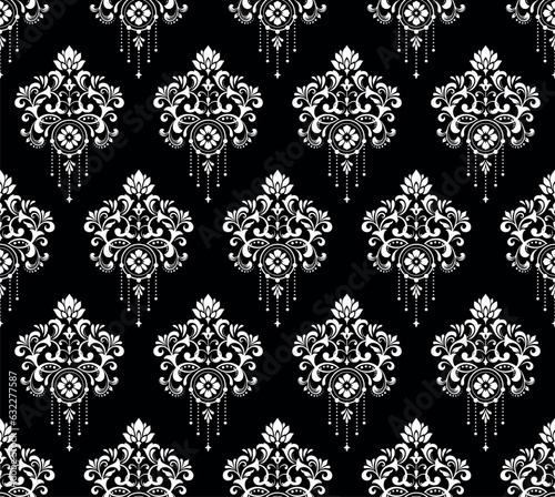 Wallpaper in the style of Baroque. Seamless vector background. White and black floral ornament. Graphic pattern for fabric, wallpaper, packaging. Ornate Damask flower ornament