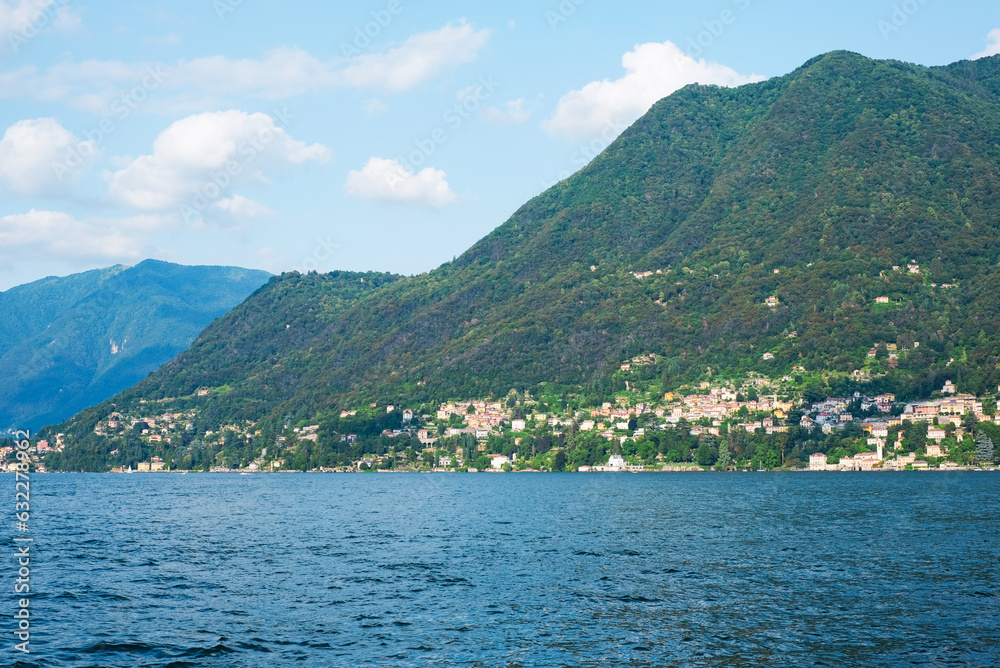 Beautiful view of Como Lake or Lago di Como in summer. Popular tourist attraction in Lombardy, Northern Italy.