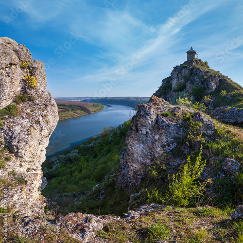 Amazing spring view on the Dnister River Canyon with picturesque rocks, fields, flowers. This place named Shyshkovi Gorby,  Nahoriany, Chernivtsi region, Ukraine. photo