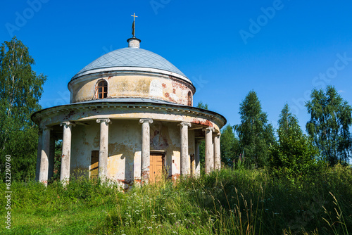 Beautiful summer view of the Manor Znamenskoye Raek in Tver region, Russia. Abandoned Palace and Park Complex in the forest. The manor house and the circular colonnade. photo