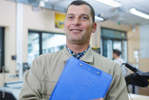 portrait of male aero engineer with clipboard
