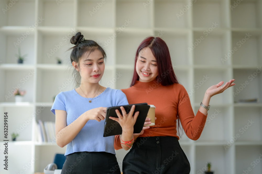 Two Young businesswomen talk, consult, discuss working with new startup project idea. Two Young businesswomen talk, consult, discuss working with new startup project idea.