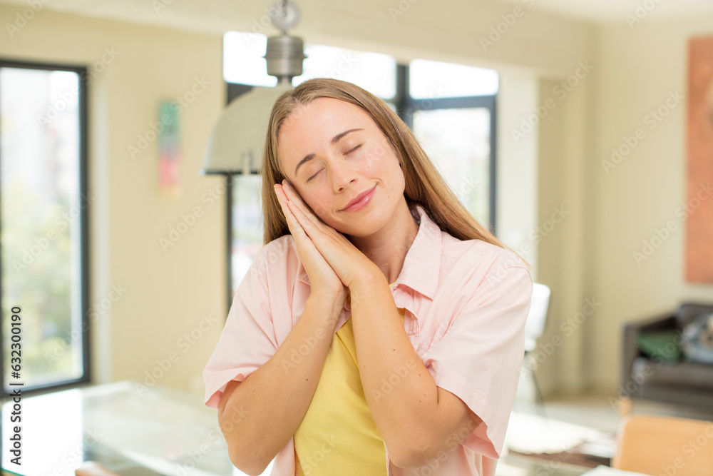 pretty blond woman lazily early in the morning, waking and looking sleepy, tired and bored pretty blond woman lazily early in the morning, waking and looking sleepy, tired and bored
