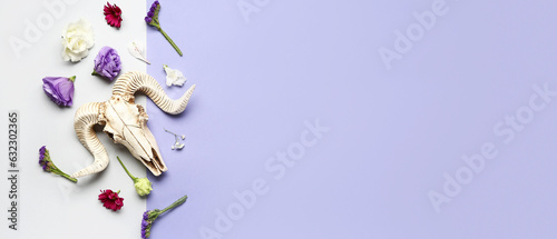 Composition with skull of sheep and beautiful flowers on color background with space for text