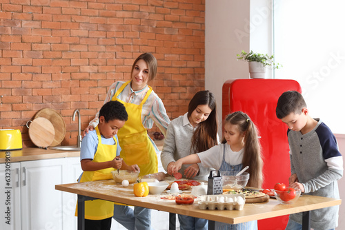 Female chef with group of l...