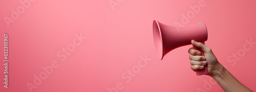 Generative AI, megaphone in hand on a empty pink background, panoramic image with copy space