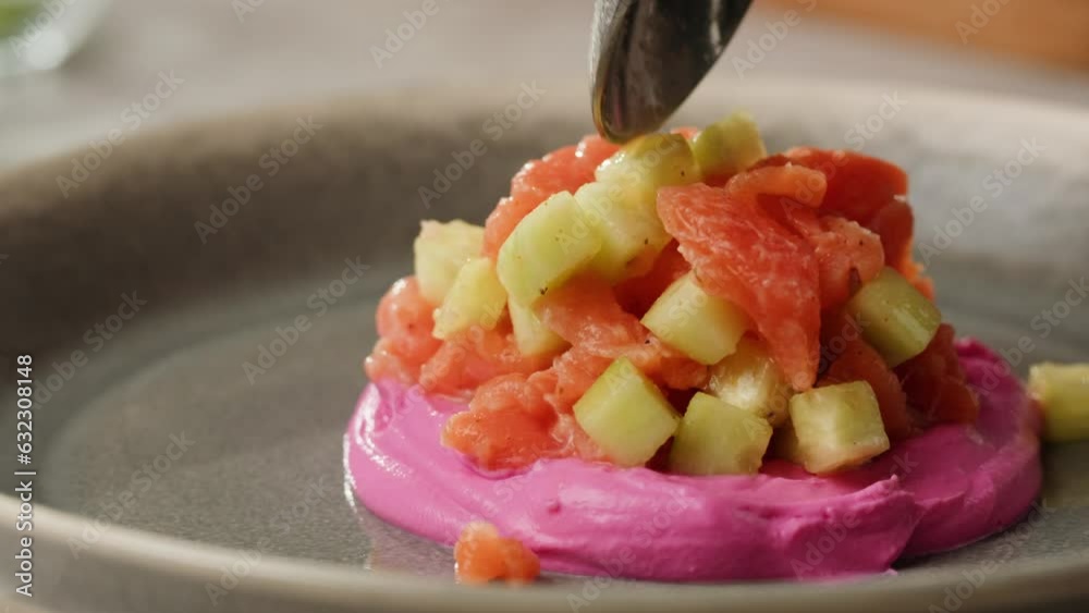 Chilean salmon tartar seviche with pouring lemon lime and grapefruit juice, onion Healthy diet food, close up red fish tar tar. Chilean salmon tartar seviche with pouring lemon lime and grapefruit juice, onion Healthy diet food, close up red fish tar tar.