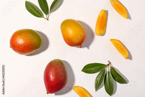 Fresh ripe mangoes on white  background