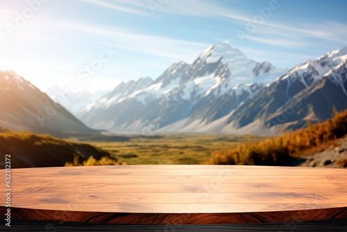 The empty wooden table top with blur background of mountains