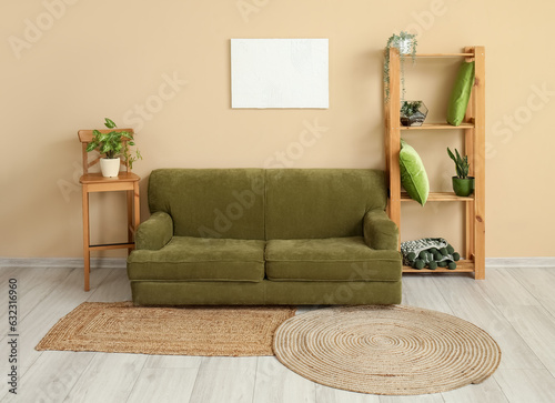 Wallpaper Mural Interior of living room with cozy green sofa, shelving unit and houseplants Torontodigital.ca