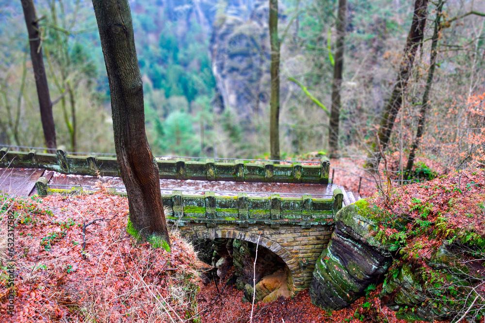 Old stone bridge among the trees on the top of the mountain Old stone bridge among the trees on the top of the mountain