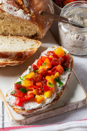 Obraz na płótnie Bruschetta from homemade bread with cottage cheese and sprat pate and tomatoes on a wooden background. Rustic style. w salonie