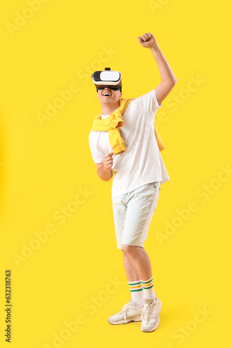 Young man in VR glasses dan...