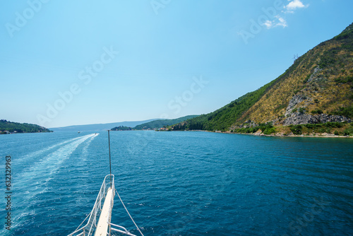 sea cruise with a view of the Bay of Kotor in Montenegro, beautiful views of nature and mountains, occasional yachts, travel