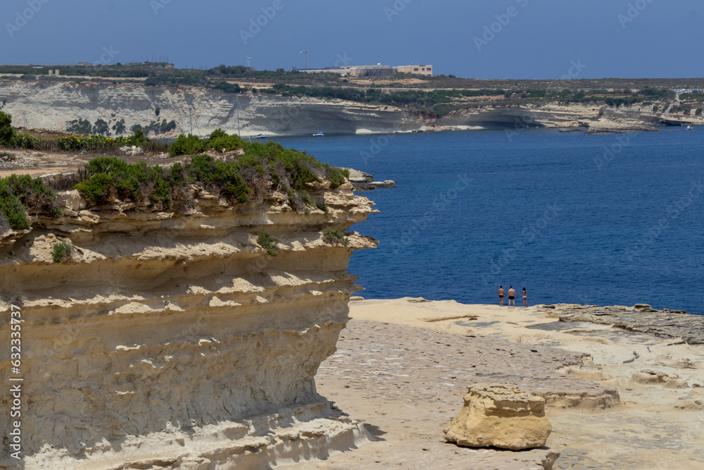 View on the beach and cliffs by Il-Ħofra ż-Żgħira Bay in Malta