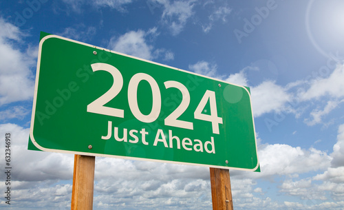 2024 Just Ahead Green Road Sign Over Clouds and Blue Sky.