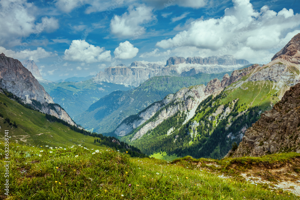 Fototapeta premium landscape with mountains, clouds and meadow