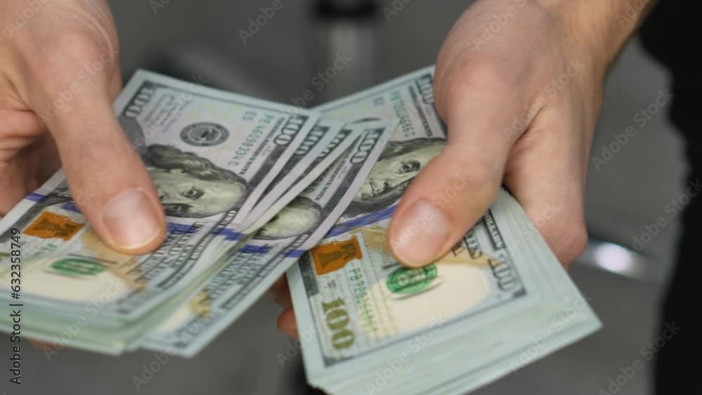 The accumulation of money in hand indicates a successful completed work period and salary, which contributes to financial growth and excellent management funds. Recalculation one hundred dollar bills The accumulation of money in hand indicates a successful completed work period and salary, which contributes to financial growth and excellent management funds. Recalculation one hundred dollar bills